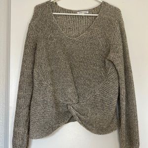 A round cris cross sweater